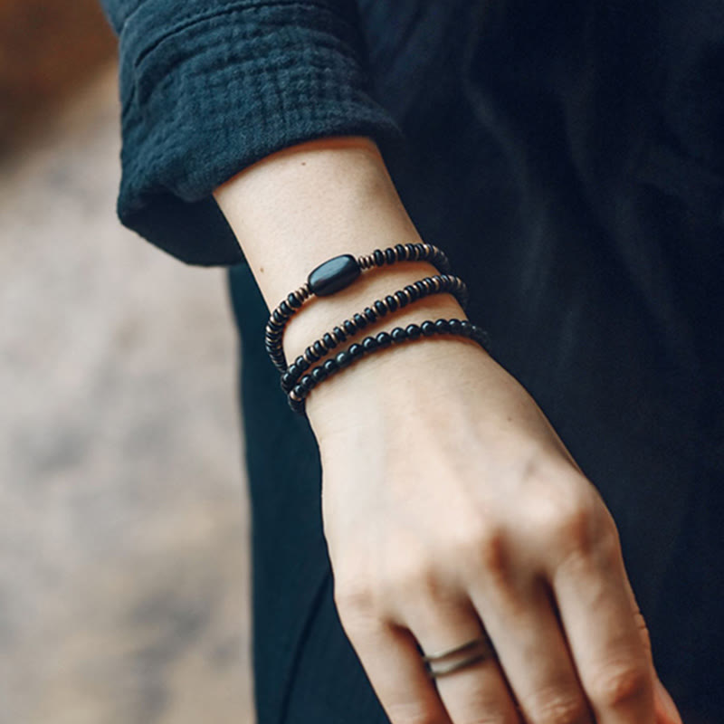 Bransoletka lecznicza z Buddha Stones, tęczowym obsydianem, drewnem hebanowym i miedzią, potrójnie owinięta