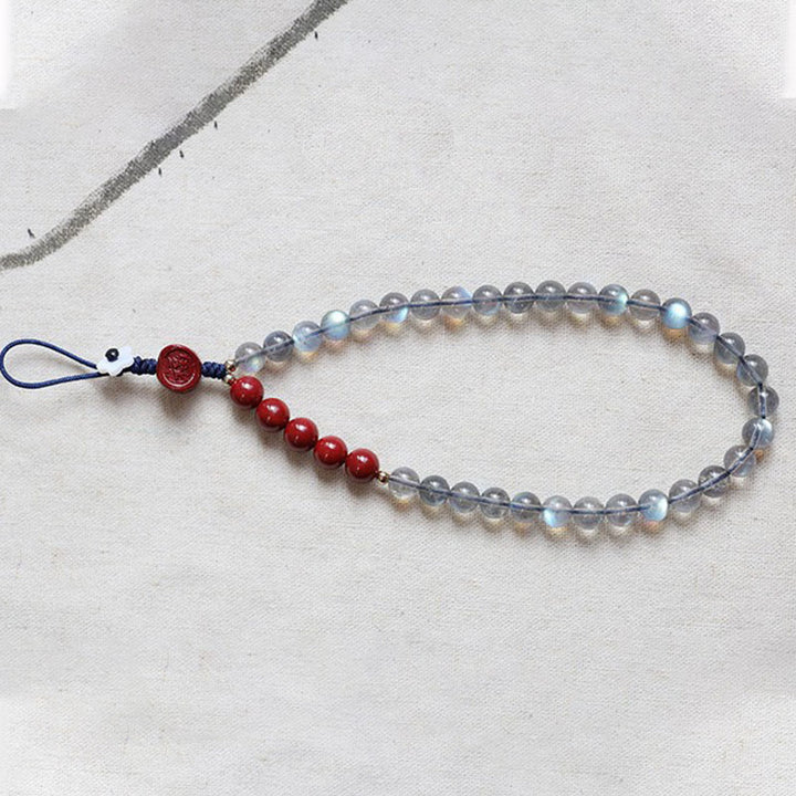 Naturalny kamień księżycowy cynober spokojna pozytywna dekoracja telefonu