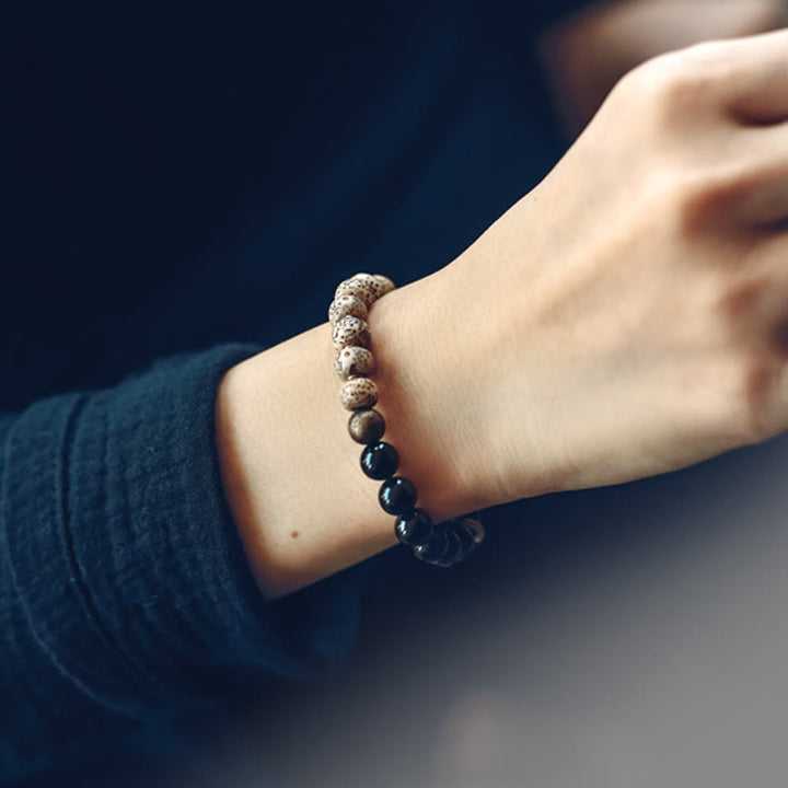 Buddha Stones Tybetańskie Nasiona Bodhi Czarny Obsydian Drewno Hebanowe Miedź Bransoletka Spokoju