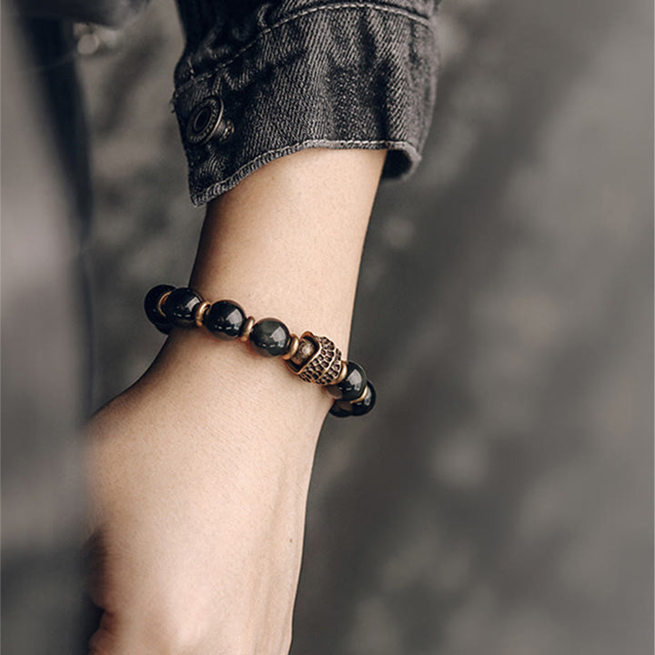 Bransoletka uzdrawiająca z tęczowego obsydianu i miedzi z Buddha Stones