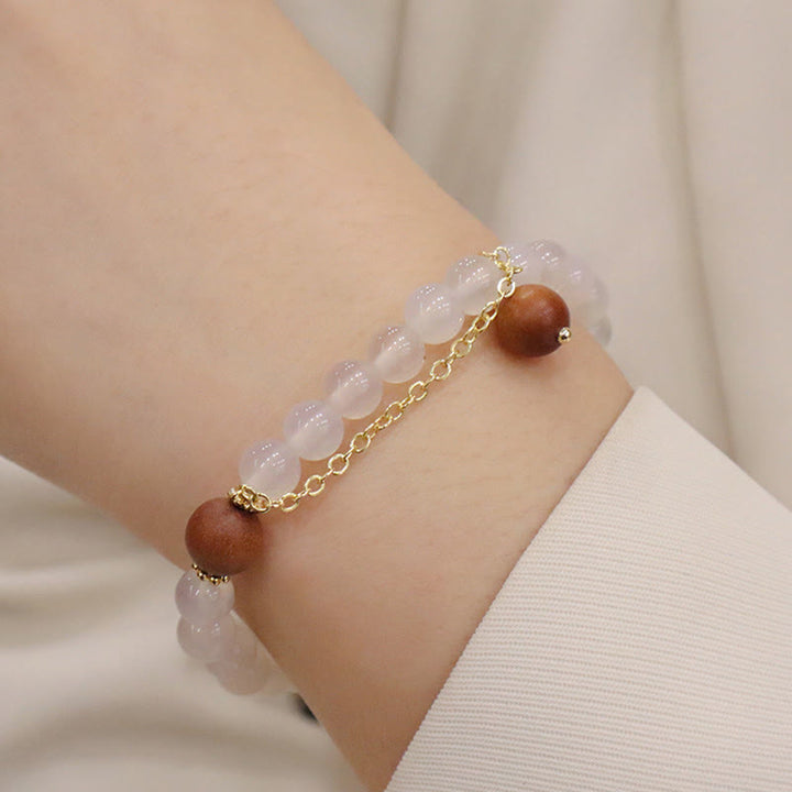 Bransoletka ochronna z Buddha Stones, sandałowym drzewem i kocim okiem Fu Character Charm