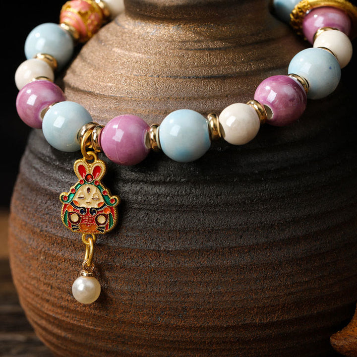 Buddha Stones Tybetańskie Zakiram Bogini Bogactwa Królik Głowa Lwa Charm Liuli Szkło Kadzidło Popiół Porcelanowa Koralik Ochrona Bransoletka