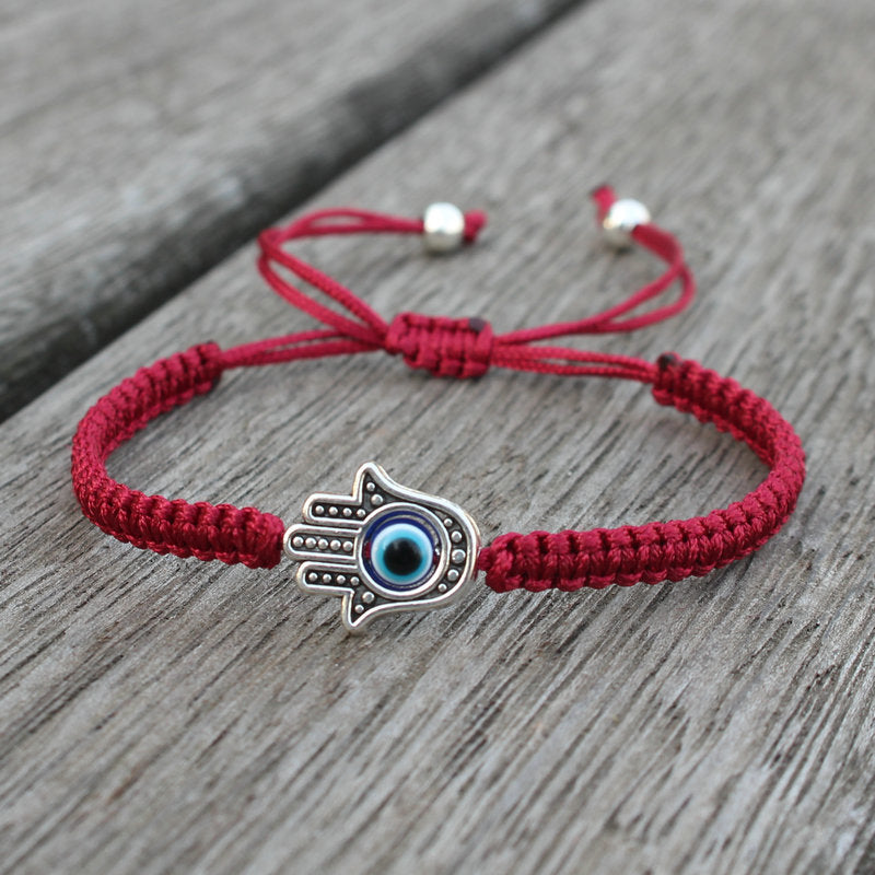 Bransoletka ze sznurka ochronnego z Buddha Stones , symbolem Hamsa, zapewniająca szczęście