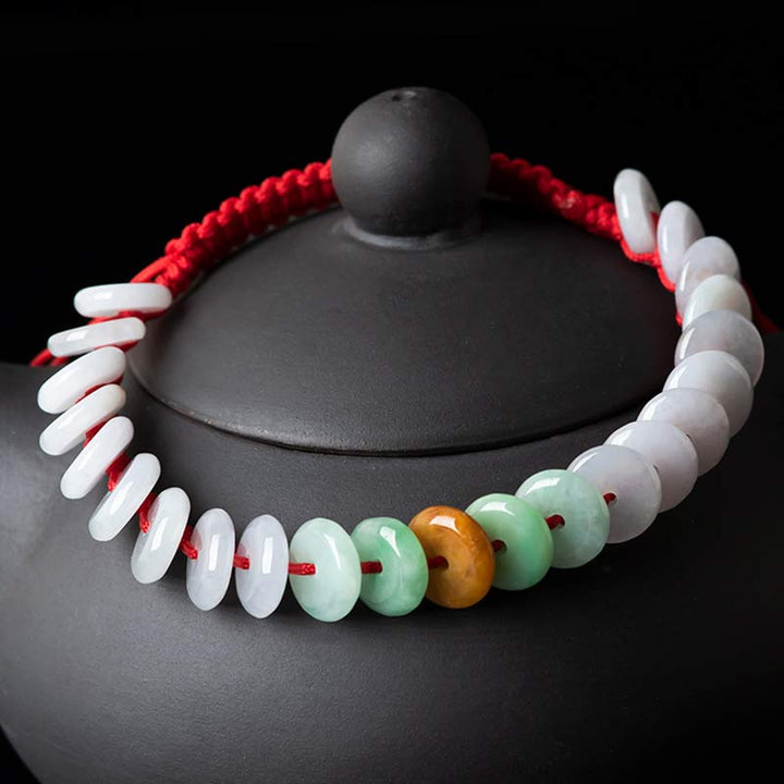 Bransoletka z okrągłym jadeitem i czerwonymi sznurkami Buddha Stones