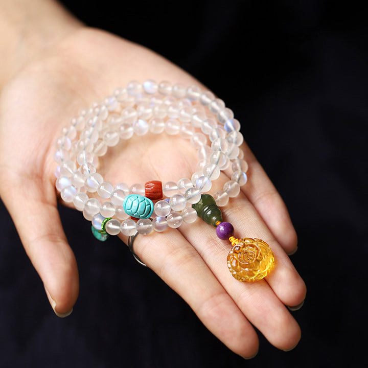 Buddha Stones 108 Mala Koraliki Kamień Księżycowy Bursztyn Lotos Turkus Kryształ Bransoletka Uzdrawiająca