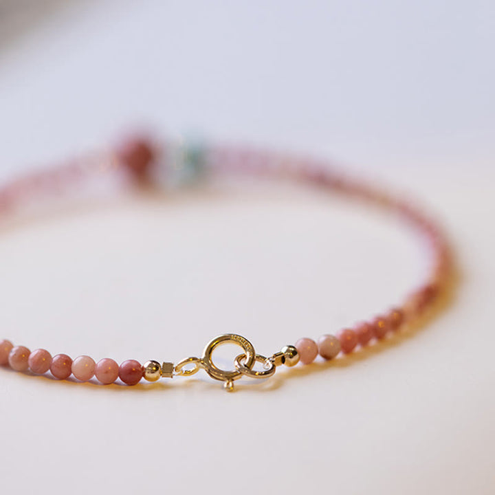Bransoletka z naturalnego rodonitu i łańcuszka energetycznego z Buddha Stones 14K pozłacana
