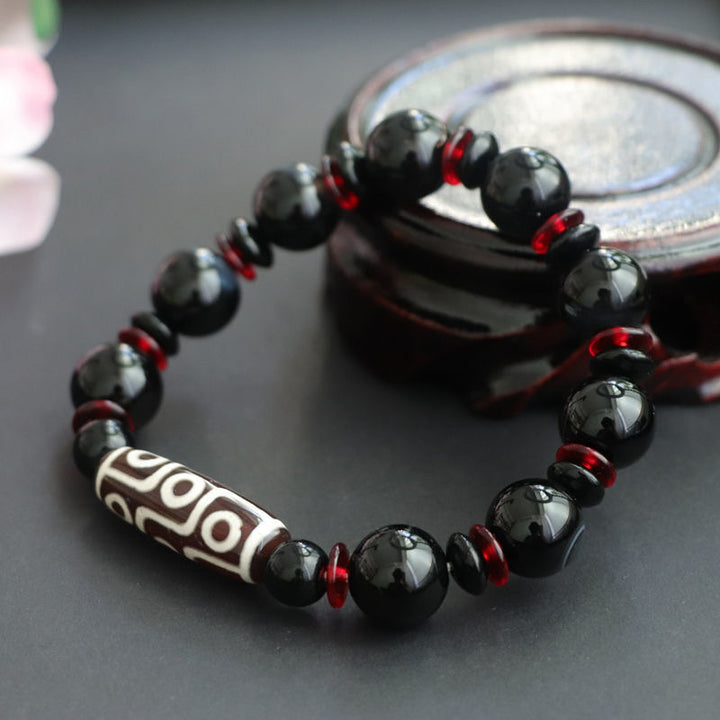 Bransoletka z Buddha Stones z czarnego onyksu i dziewięcioocznych koralików Dzi, chroniąca bogactwo
