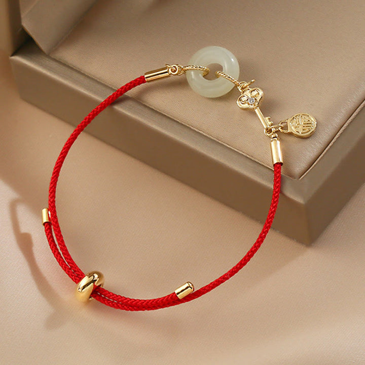 Buddha Stones 18K pozłacane Hetian Jade Peace Buckle Fu Character Luck Red Rope Bracelet