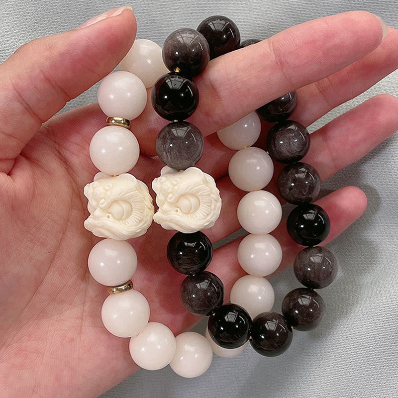 Buddha Stones Srebrny połysk Obsydian Nasiona Bodhi Kość Słoniowa Owoce Tańczący Lew Bransoletka Ochronna
