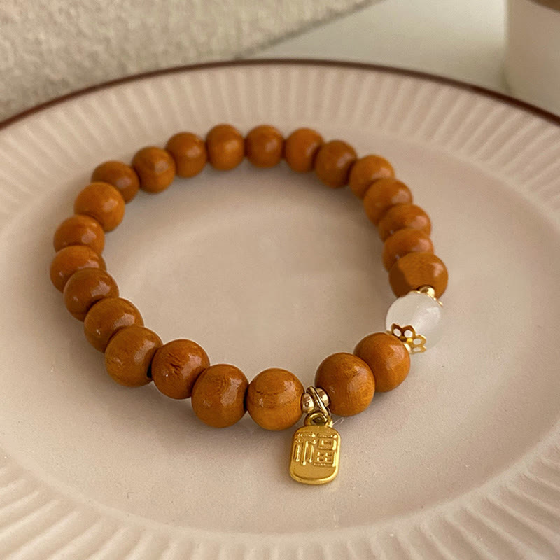 Bransoletka ochronna z Buddha Stones, sandałowym drzewem i kocim okiem Fu Character Charm