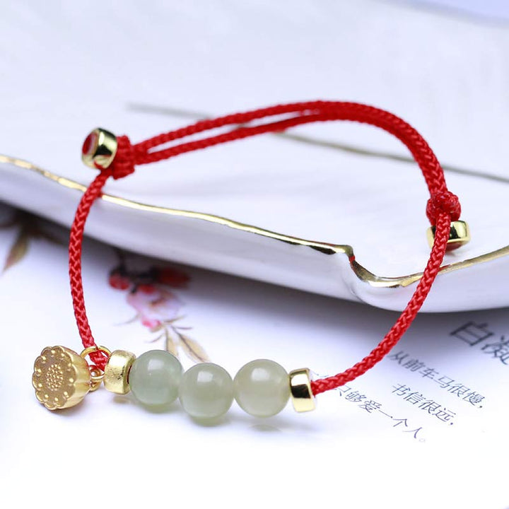 Bransoletka z naturalnego jadeitu i nasion lotosu z czerwonej nici Buddha Stones