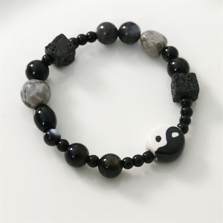 Bransoletka ochronna z Buddha Stones z czarnego onyksu i koralikami z jaspisu Picasso Yin Yang