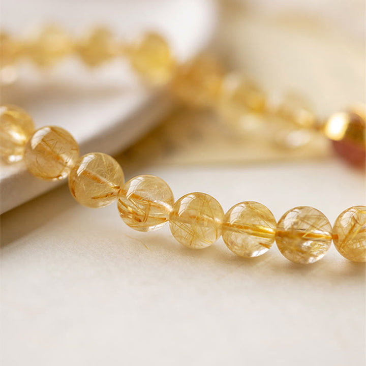 Bransoletka ochronna Buddha Stones Golden Rutilated Quartz i truskawkowy kwarc Star
