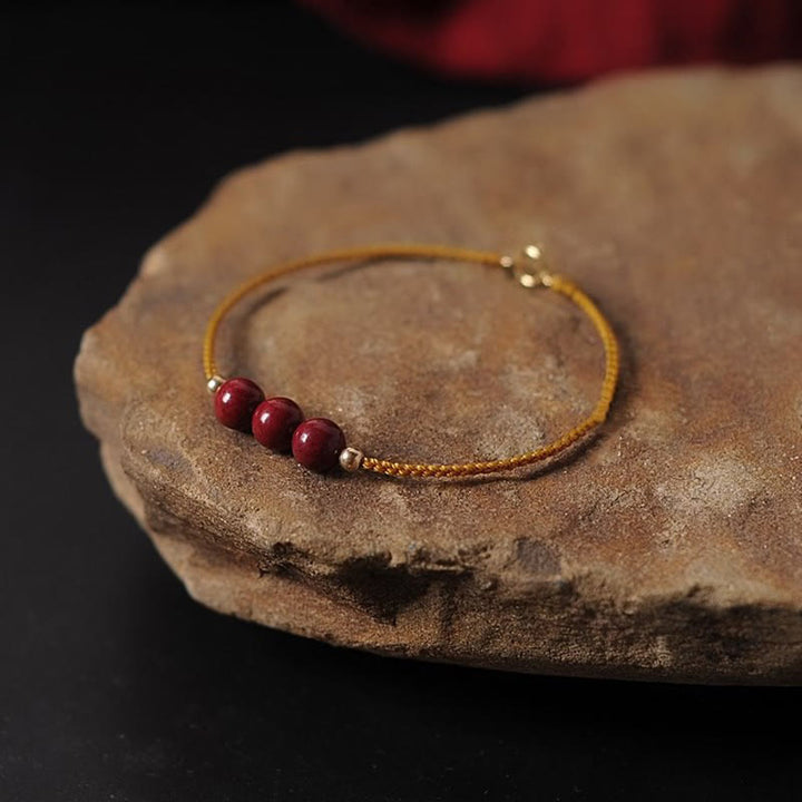 Bransoletka z naturalnego sznurka błogosławieństwa z Buddha Stones 14K pozłacana cynobrem
