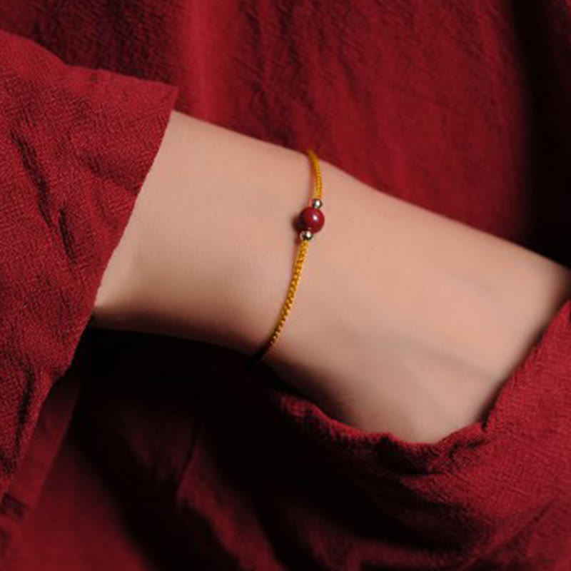 Bransoletka z naturalnego sznurka błogosławieństwa z Buddha Stones 14K pozłacana cynobrem