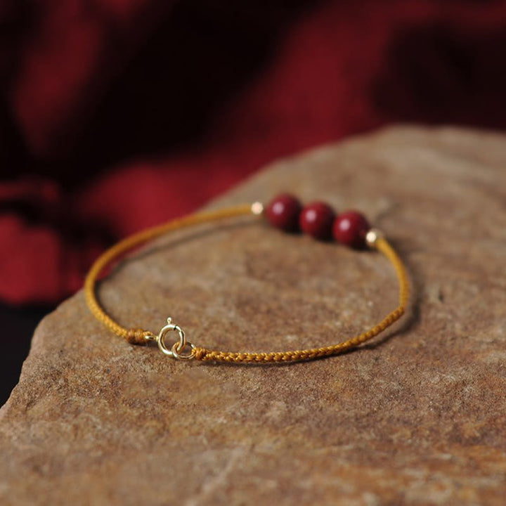 Bransoletka z naturalnego sznurka błogosławieństwa z Buddha Stones 14K pozłacana cynobrem