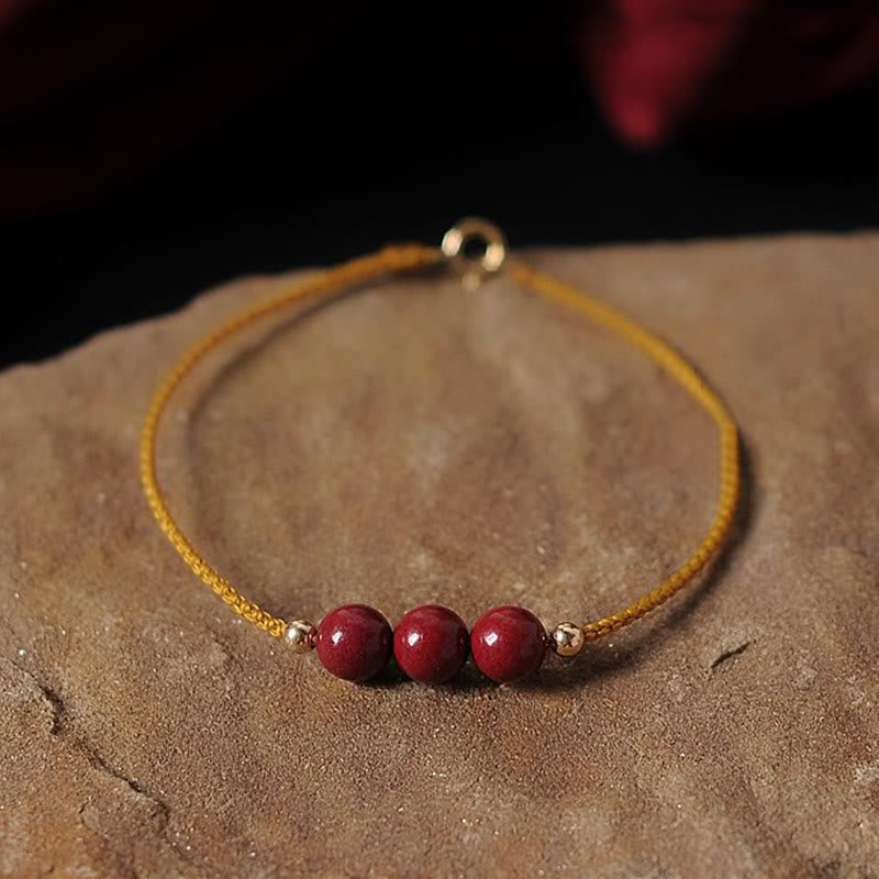 Bransoletka z naturalnego sznurka błogosławieństwa z Buddha Stones 14K pozłacana cynobrem