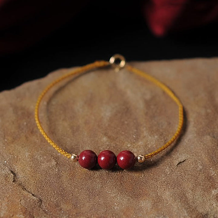 Bransoletka z naturalnego sznurka błogosławieństwa z Buddha Stones 14K pozłacana cynobrem