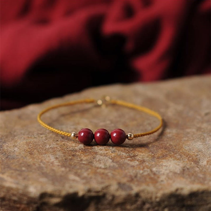 Bransoletka z naturalnego sznurka błogosławieństwa z Buddha Stones 14K pozłacana cynobrem