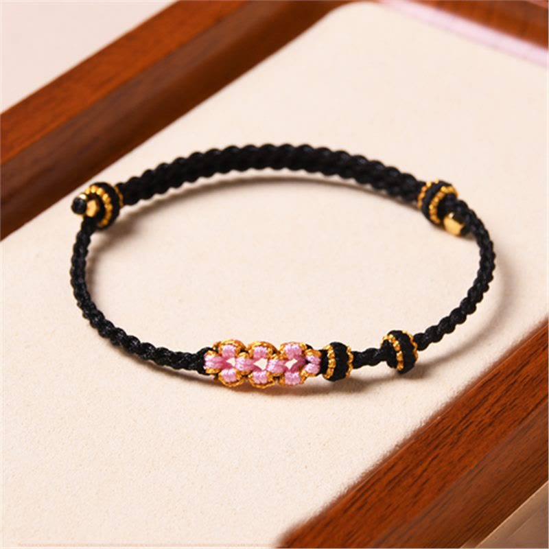 Bransoletka z plecionej liny z Buddha Stones wykonana ręcznie z brzoskwiniowego kwiatu