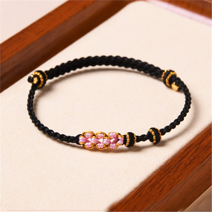 Bransoletka z plecionej liny z Buddha Stones wykonana ręcznie z brzoskwiniowego kwiatu