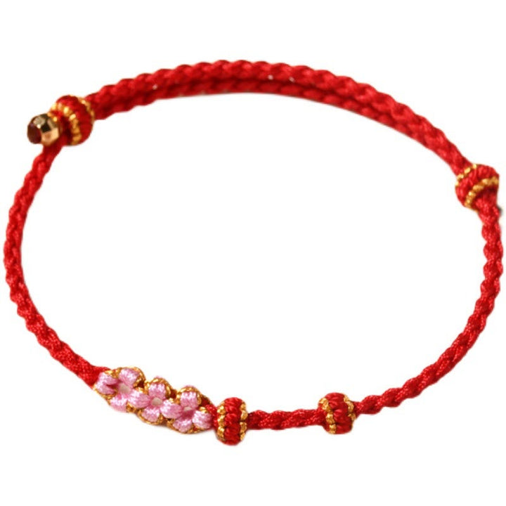 Bransoletka z plecionej liny z Buddha Stones wykonana ręcznie z brzoskwiniowego kwiatu