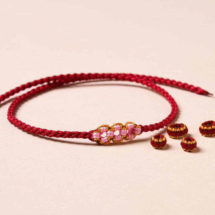Bransoletka z plecionej liny z Buddha Stones wykonana ręcznie z brzoskwiniowego kwiatu