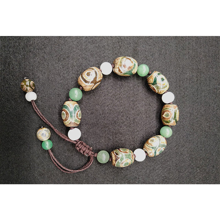 Buddha Stones Tybetańskie Trójoczne Dzi Koraliki Ochrona Szczęścia Bransoletka Pleciona