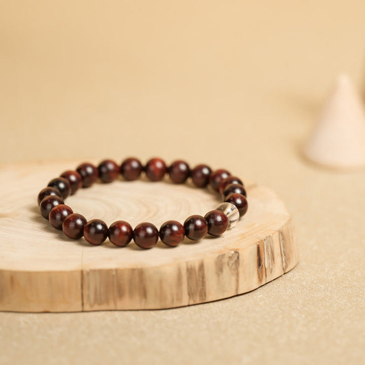 Bransoletka ochronna z małych liści z czerwonego drzewa sandałowego i białego kryształu z Buddha Stones