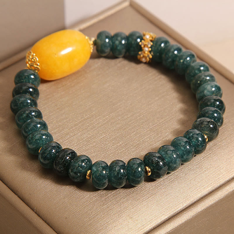 Bransoletka z Buddha Stones, zielonych jadeitowych koralików Abacus i topazu, z której można uzyskać szczęście