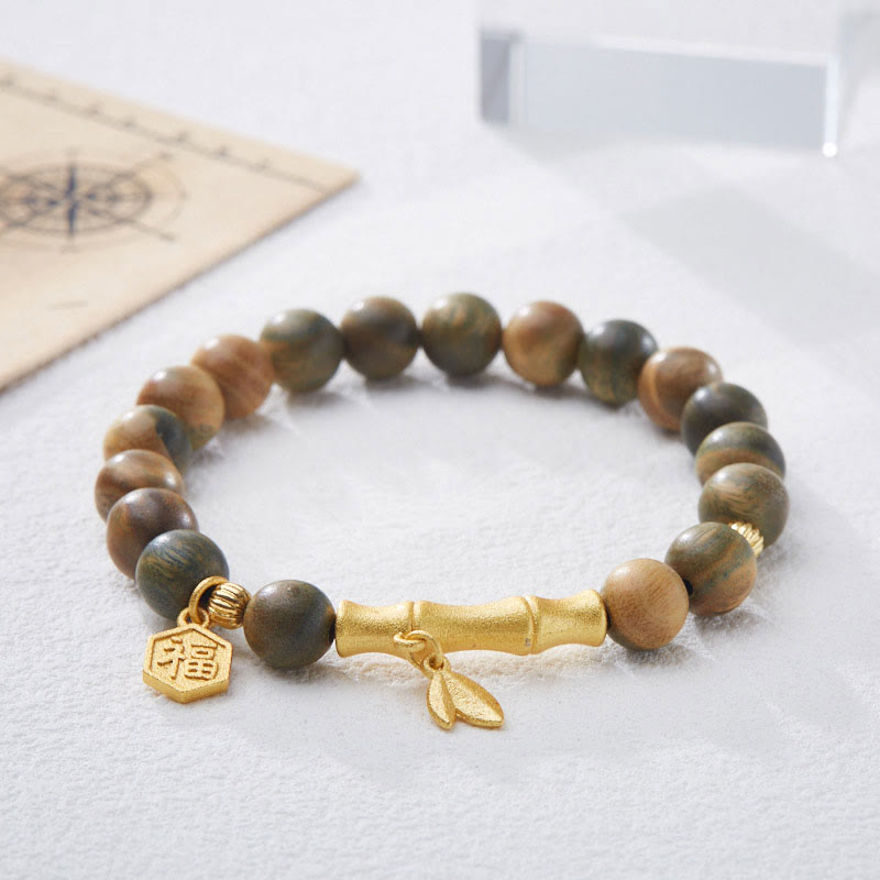 Bransoletka uspokajająca z zielonego drzewa sandałowego i bambusa Fu Character z Buddha Stones