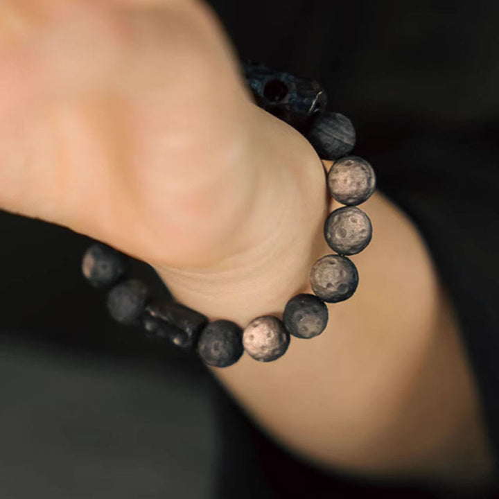 Bransoletka uspokajająca z Buddha Stones w kolorze srebrnym i obsydianem z drewna hebanowego