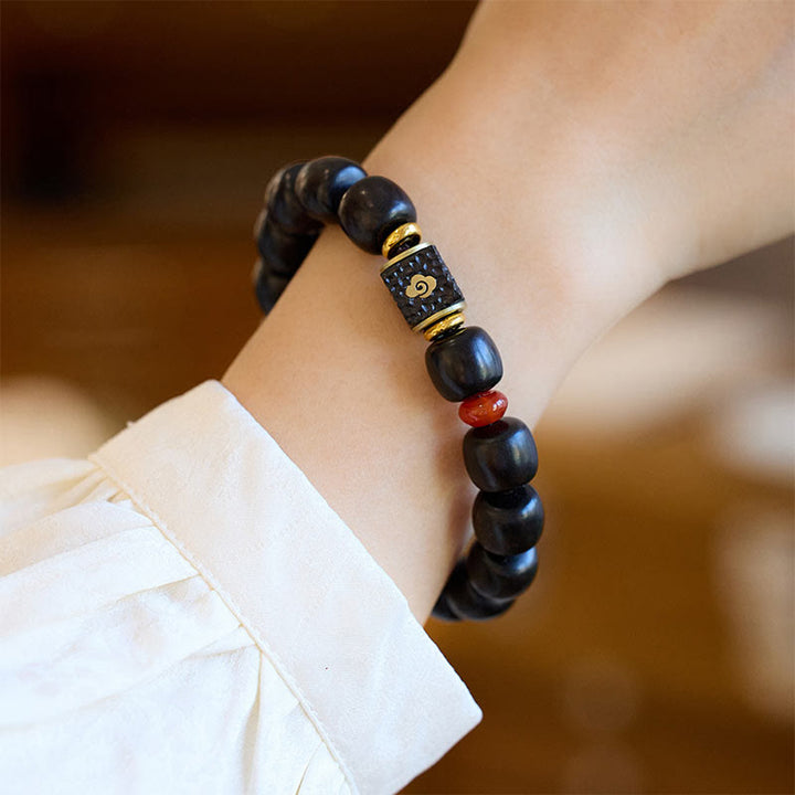 Bransoletka Buddha Stones Ebony Drewno Pomyślne Chmury Grawerowane Spokojne