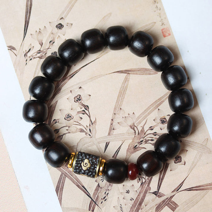 Bransoletka Buddha Stones Ebony Drewno Pomyślne Chmury Grawerowane Spokojne