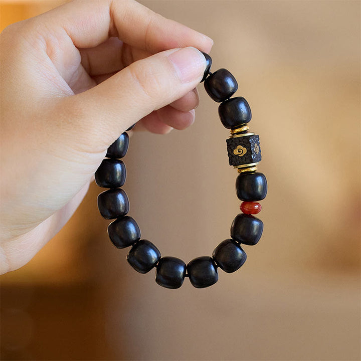 Bransoletka Buddha Stones Ebony Drewno Pomyślne Chmury Grawerowane Spokojne