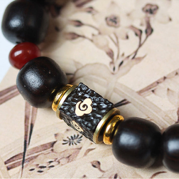 Bransoletka Buddha Stones Ebony Drewno Pomyślne Chmury Grawerowane Spokojne