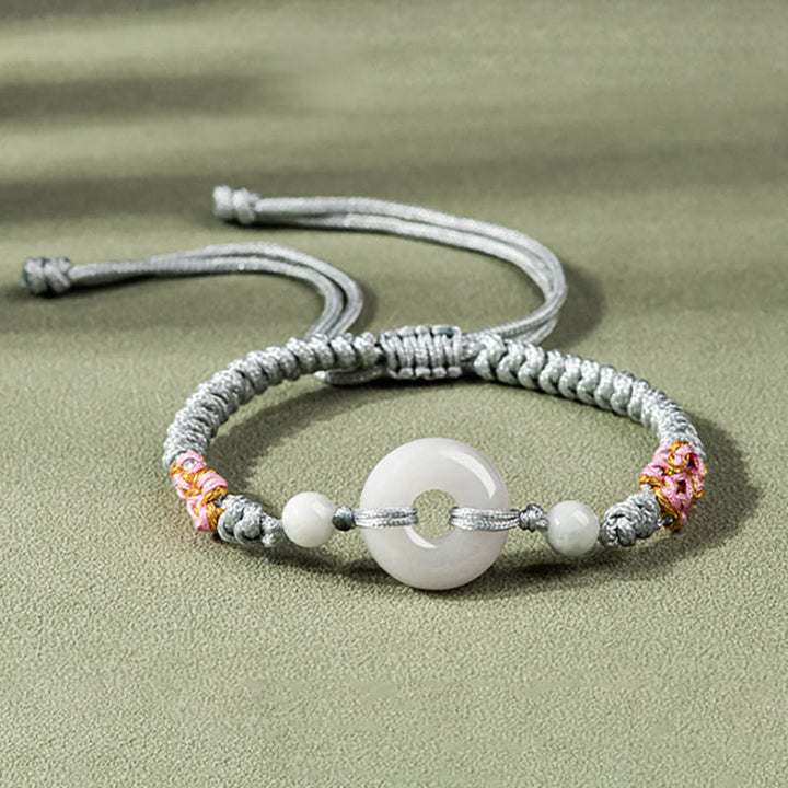 Bransoletka z czerwonego sznurka z jadeitu i Buddha Stones