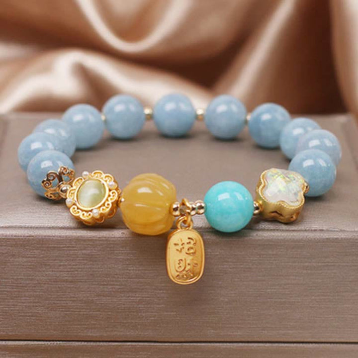 Bransoletka chroniąca bogactwo z Buddha Stones, akwamarynu i dyni