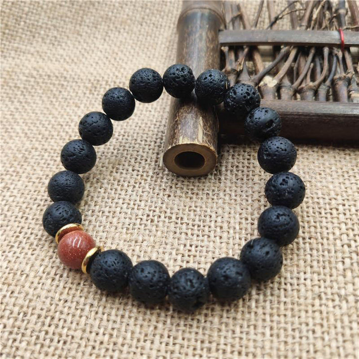 Bransoletka lecznicza z Buddha Stones , kamieniami lawowymi, kamieniami złotymi i niebieskim piaskowcem