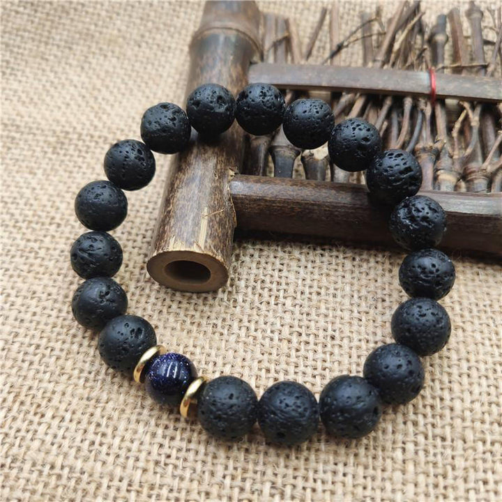 Bransoletka lecznicza z Buddha Stones , kamieniami lawowymi, kamieniami złotymi i niebieskim piaskowcem