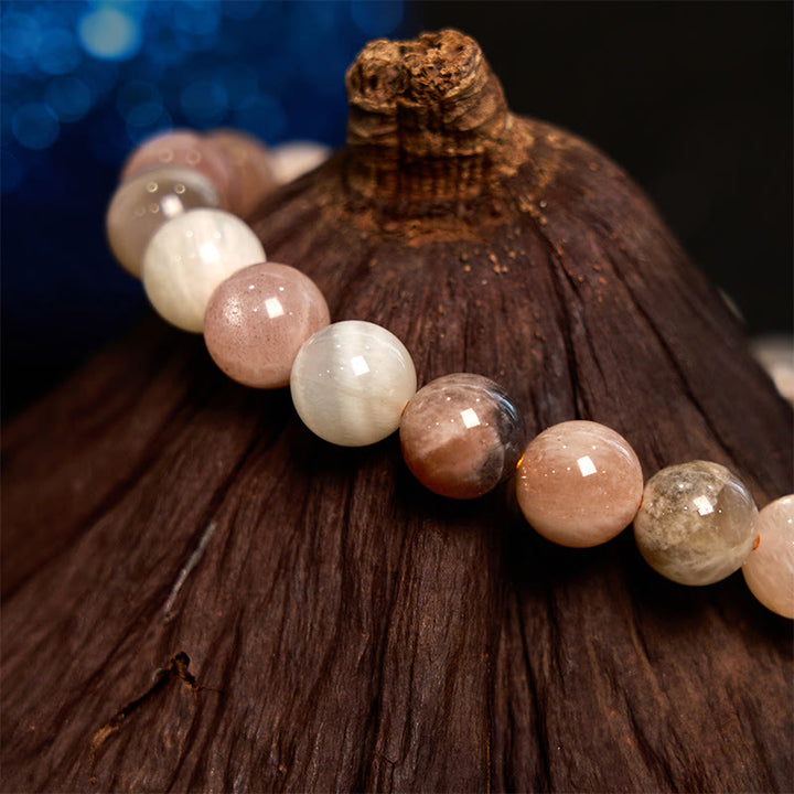 Bransoletka lecznicza z Buddha Stones i brzoskwiniowym kamieniem księżycowym