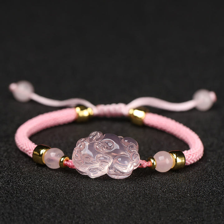 Bransoletka z różowym kryształem i Buddha Stones PiXiu Wealth String Braided