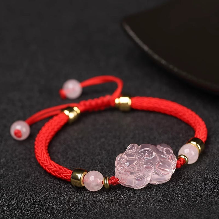 Bransoletka z różowym kryształem i Buddha Stones PiXiu Wealth String Braided