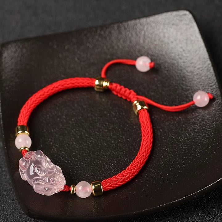 Bransoletka z różowym kryształem i Buddha Stones PiXiu Wealth String Braided