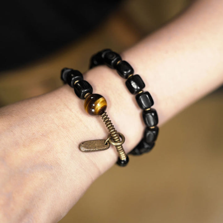 Bransoletka Buddha Stones Ebony Drewno Miedź Mosiądz Tygrysie Oko Pokój Podwójne Owijanie