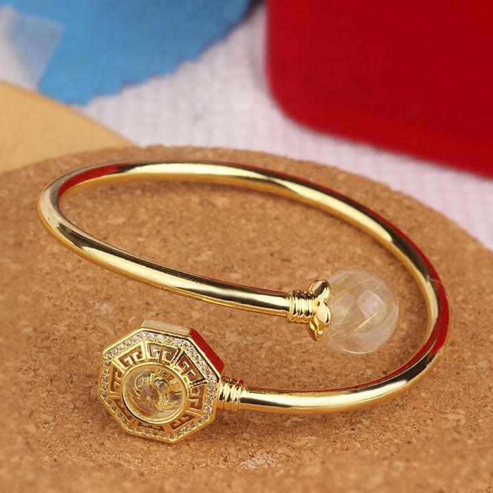 Buddha Stones Rutilated Quartz Miedź Mosiądz Obrotowy Wiatrak Feng Sheng Shui Qi Odwaga Bransoletka Bangle