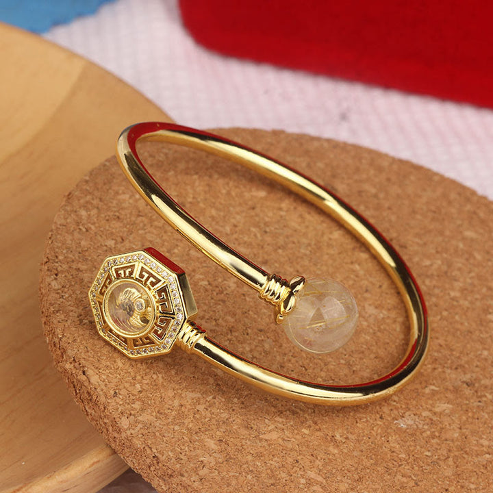 Buddha Stones Rutilated Quartz Miedź Mosiądz Obrotowy Wiatrak Feng Sheng Shui Qi Odwaga Bransoletka Bangle