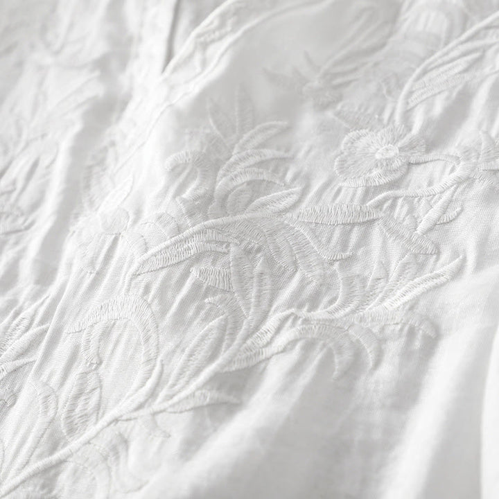 Letnia sukienka midi z haftowanymi liśćmi i kwiatami Buddha Stones w kolorze białym, z krótkim rękawem i dekoltem w serek i kieszeniami - image 5