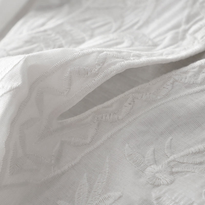 Letnia sukienka midi z haftowanymi liśćmi i kwiatami Buddha Stones w kolorze białym, z krótkim rękawem i dekoltem w serek i kieszeniami - image 7