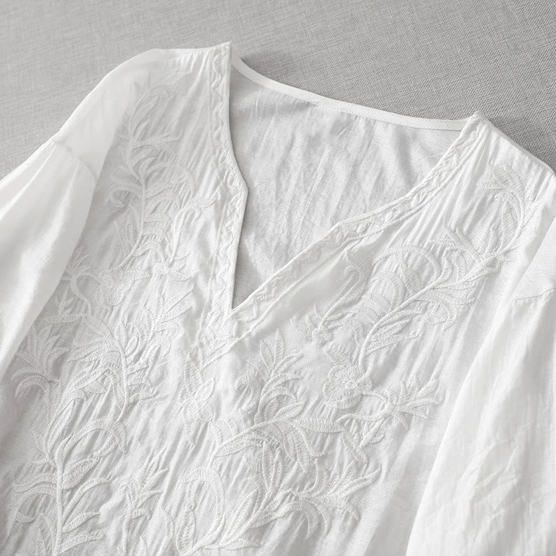 Letnia sukienka midi z haftowanymi liśćmi i kwiatami Buddha Stones w kolorze białym, z krótkim rękawem i dekoltem w serek i kieszeniami - image 2